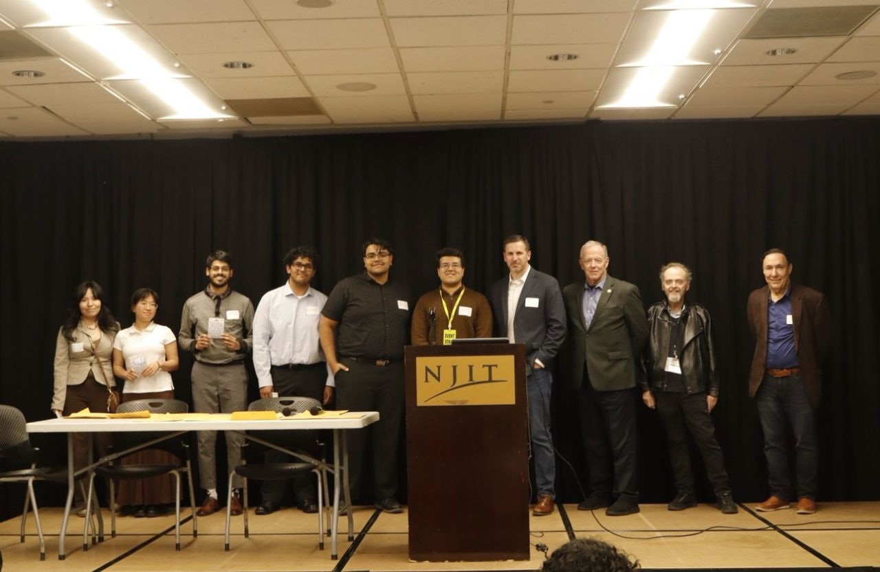 UPS capstone team with sponsors and judges at NJIT showcase